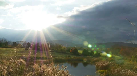 2407 Sunset Behind Mountians and Pond with Flare During Fall, HD Stock Footage 43248401