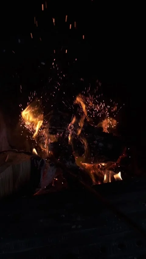 240fps slow motion fire, fireplace sparks flying (portrait) FUJI XT4 Stock Footage
