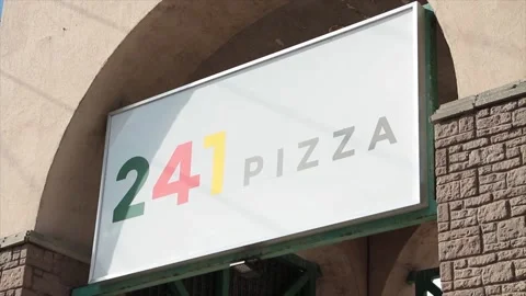 241 pizza restaurant store rectangle sign logo under arch arc in summer outside Stock-Footage 250281028