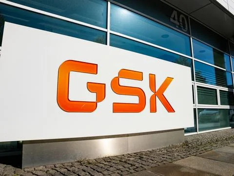 GSK logo of the global pharma company. New sign of the former GlaxoSmithKline plc. Global business operating in the health care industry. xkwx brand british building business company dresden economy entrance facility germany glaxosmithkline global gsk health care industry international label logo medicine nobody outdoor party pharma pharmaceuticals saxony sign