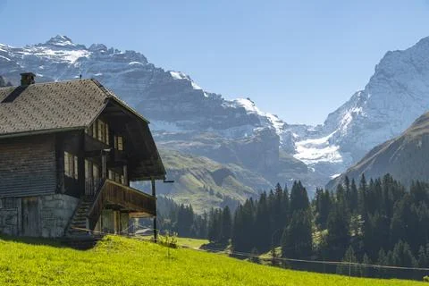 Switzerland Mountain valley Kiental, Berner Oberland Alps. Snow mountains, sunny weather, travel to Swiss. xkwx adventure panorama kiental peak rock scenery september snow summit swiss switzerland top tourism glacier river tourist Kandersteg travel traveler trekking vacation valley outdoor oberland mountains alpine alps beautiful walking mountain landscape hiking berner hill jungfrau nature endurance countryside bernese journey europe extreme traditional house