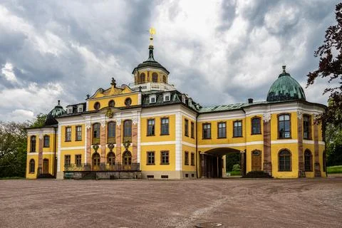 Weimar, Germany - May 12, 2023: Castle Belvedere near Weimar Thuringia Germany is a elegant summer residence dating from 18th century. View from the Castle park. xkwx weimar germany belvedere palace castle park schloss thuringia goethe schiller building architecture travel baroque landmark facade residence historical garden landscape yellow heritage history house old unesco culture panorama historic monument tourism chateau university pavillon orangery visit green orangerie europe experience destination countryside tree orange recreation