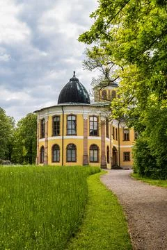 Weimar, Germany - May 12, 2023: Castle Belvedere near Weimar Thuringia Germany is a elegant summer residence dating from 18th century. View from the Castle park. xkwx weimar germany belvedere palace castle park schloss thuringia goethe schiller building architecture travel baroque landmark facade residence historical garden landscape yellow heritage history house old unesco culture panorama historic monument tourism chateau university pavillon orangery visit green orangerie europe experience destination countryside tree orange recreation