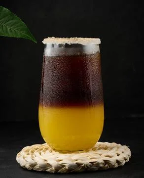 Iced coffee with orange juice in a transparent glass, refreshing bumble coffee on the table, black background xkwx layer coffee orange brown sweet cool ice espresso cold drink glass fresh juice beverage cocktail morning caffeine fruit syrup table yellow citrus juicy bumble slice nobody black