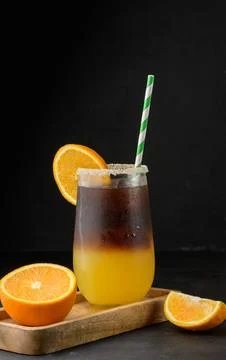 Iced coffee with orange juice in a transparent glass, refreshing bumble coffee on the table xkwx layer coffee orange brown sweet cool ice espresso cold drink glass fresh juice beverage cocktail morning caffeine fruit syrup table yellow citrus juicy bumble slice nobody black