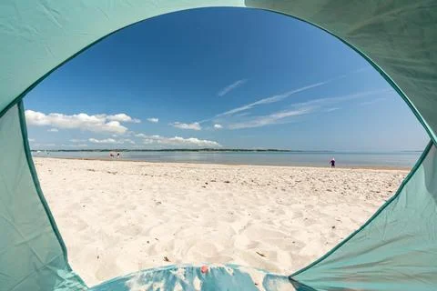 View from inside a tent onto beautiful white sand beach at the Baltic Sea at the Flensburger Förde in North Germany xkwx Beach sea ocean tent beach shelter camping Baltic Sea travel vacation holiday landscape coast campsite shore seashore POV outdoors camp adventure trip tourism backpacking active seascape peaceful calm quiet Germany Northern Germany coastline relax tranquil scenic beautiful view nature Holnis Flensburger Frde Foerde