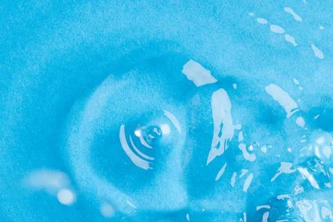 Close up of water drop falling into water with ripples and copy space on blue background. Water, liquid and colour concept. xkwx No People Close Water Drop Falling Water Ripple Copy Space Blue Background Liquid Colour Concept Drop Splash Abstract Design Background Wet Flow Fluid Closeup Wave Illustration Macro Business Graphic Symbol Isolated Flowing Color Clean Drink Water Falling Copy Space Blue