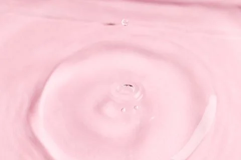 Close up of water drop falling into water with ripples and copy space on pink background. Water, liquid and colour concept. xkwx No People Close Water Drop Falling Water Ripple Copy Space Pink Background Liquid Colour Concept Drop Splash Abstract Design Background Wet Flow Fluid Closeup Wave Illustration Macro Business Graphic Symbol Isolated Flowing Color Clean Drink Water Falling Copy Space Pink