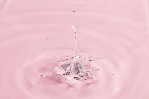 Close up of water drop falling into water with ripples and copy space on pink background. Water, liquid and colour concept. xkwx No People Close Water Drop Falling Water Ripple Copy Space Pink Background Liquid Colour Concept Drop Splash Abstract Design Background Wet Flow Fluid Closeup Wave Illustration Macro Business Graphic Symbol Isolated Flowing Color Clean Drink Water Falling Copy Space Pink