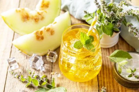 Fresh refreshing fruity summer drink, seasonal beverages. Melon lemonade in glasses with ice and mint on a wooden rustic table. xkwx beverage leaf green drink glass ice summer rustic dessert tropical homemade cantaloupe yellow juicy fruit nutrition vitamin delicious nutritious juice tasty wooden water smoothie melon selective orange blended diet ripe vegetarian honey slice beverages lemonade non-alcoholic drinking natural healthy mint freshness food sweet fresh cocktail refreshment background cold organic
