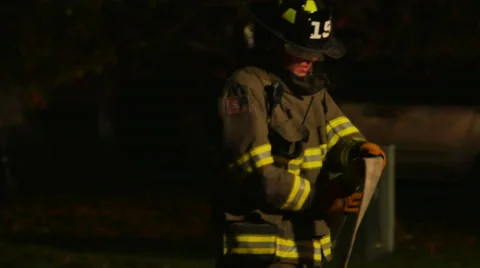 2476 Fire Man Rolling Hose up After a Hose Fire, 4K Stock Footage 43675958