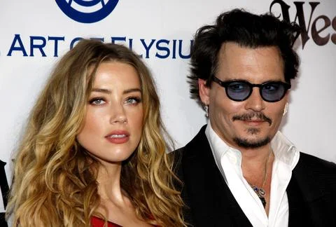 Amber Heard and Johnny Depp at the Art Of Elysium's 9th Annual Heaven Gala held at the 3LABS in Culver City, USA on January 9, 2016. xkwx actor actress celebrity talent actors actresses entertainment cinema red carpet premiere movie star celebrities fashion hollywood famous fame popular movies film success dress artist california event attractive