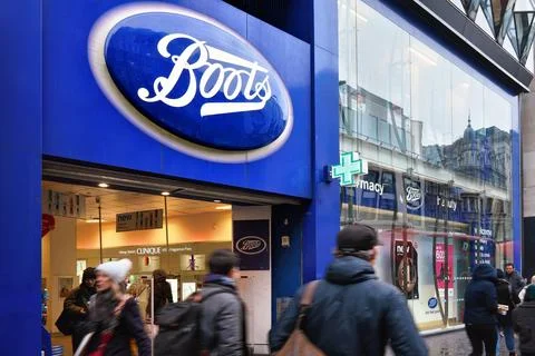 London, United Kingdom - February 01, 2019: Typical blue oval sign at one of many Boots branches in London. Boots is a health and beauty pharmacy chain in UK and few other countries xkwx boots london store entrance white blue beauty branch brand british building business chain chemist city commerce commercial company corporation drug drugstore emblem england facade front health high kingdom logo medical medication medicine name pharmaceutical pharmacist pharmacy prescription retail shop sign signage street symbol trademark uk united