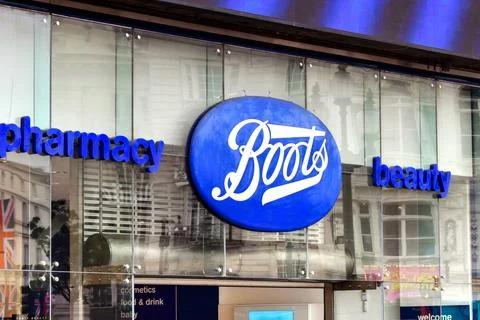 London, England, UK - 28 June 2023: Sign above the entrance of a branch of Boots Pharmacy in Piccadilly in central London, xkwx Boots chemist pharmacy shop store sign symbol logo business shopping health healthcare medicine London England UK blue