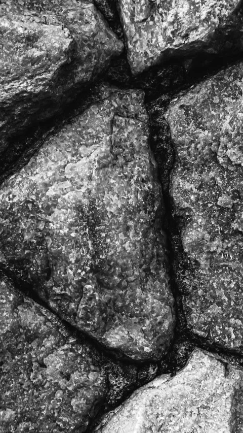 249_Rough stone wall texture in black and white.mp4 Stock Footage 347072863