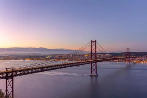 The 25 of April Bridge in Lisbon Portugal at the sunset Stock Photos