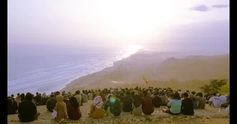 25 August 2019, IDN - Large Gathering of People Watching Sunset Over Ocean  Stock Footage 302473350