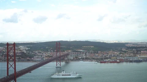 25 de Abril Bridge over the Tagus river, connecting Almada and Lisbon in Port Stock Footage 88734467