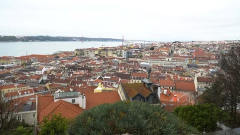 25 de Abril Bridge over the Tagus river, connecting Almada and Lisbon in Port Stock Footage 88735956