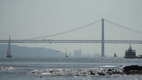 The 25 de Abril bridge over Tagus river in Lisbon, Portugal Stock-Footage 91229977