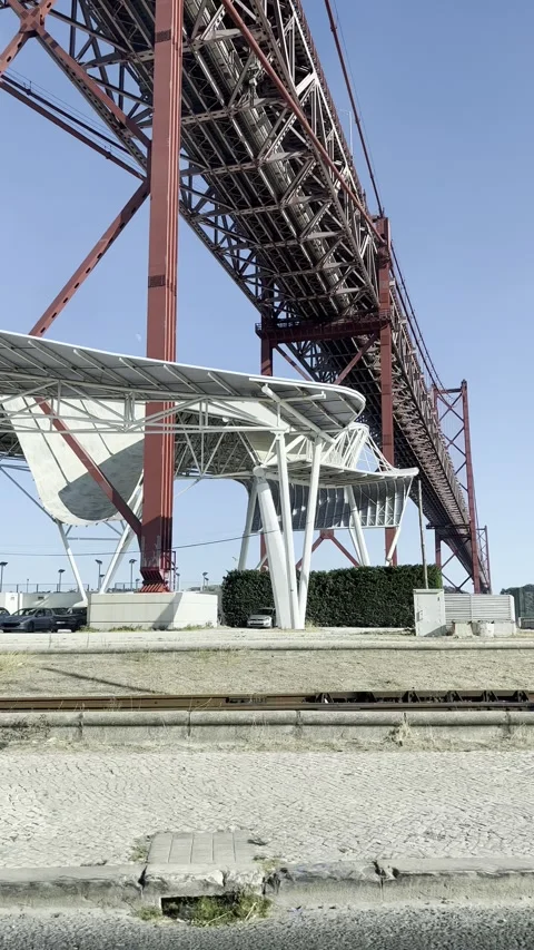 25 de Abril Bridge red steel structure, Portugal Vertical 4K Video stock 348279537