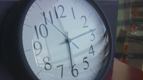 2.5 hour time lapse of wall clock reflecting the sunset and clouds moving Stock Footage 273120752