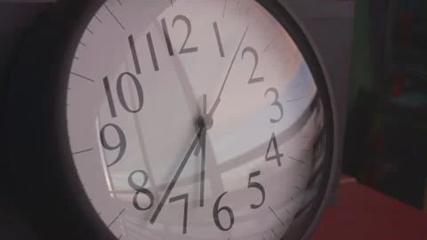 2.5 hour time lapse of wall clock reflecting the sunset and clouds moving Stock Footage 273120780