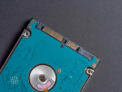 2.5 inch hard disk drive for laptop or computer on a dark paper background. T Stock Photos