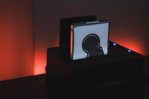 2.5 inch hard drive disk in a SATA 3.0 HDD docking station with red ambient.. Stock Photos