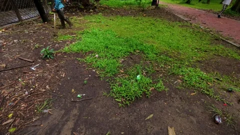 25 Man Mowing Grass with Machine Beside Road in Countryside Stock Footage 313649962