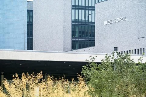 building European Union Agency for Law Enforcement Cooperation in Hague with Europol text on facade, EU institutions, counterterrorism intelligence sharing xkwx Europol police European justice organization crime building counterterrorism EU Agency Criminal European Union law enforcement security prevention international cooperation policing intelligence sharing enforcement facade architecture exterior enforcement agency criminal justice European Union security crime control cross-border partnership Europol building global headquarters crime analysis logo Hague Netherlands