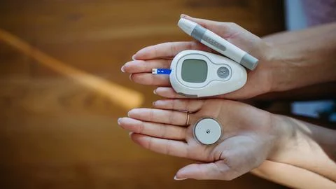 Close up of hands holding diabetes supplies and devices. Continuous glucose monitor, insulin pen, blood glucose meter. Banner with copy space. xkwx diabetes supplies devices continuous glucose monitor insulin pen blood glucose meter banner copy space medical equipment chronic illness diabetes management healthcare monitoring blood sugar treatment insulin therapy diabetic care diagnosis test self-care glucose level medicine diabetic tools type 1 type 2 technology medical device patient finger prick digital health health tech medication prevention awareness lifestyle modern treatment