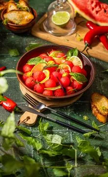 Spicy salad of fresh watermelon balls with basil, lime, rosemary and fennel, topping with olive oil on dark green table surface with sunny light xkwx watermelon vegetable summer food healthy salad basil lime rosemary freshness delicious cheese melon table organic epicure vegetarian plate fruit dinner meal sweet green diet red lunch fresh leaf juicy ripe snack herb closeup rustic overhead nourishment eating dish cookery