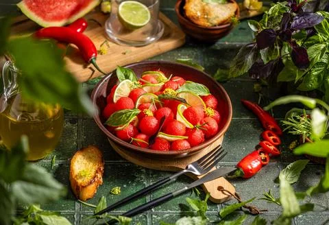 Spicy salad of fresh watermelon balls with basil, lime, rosemary and fennel, topping with olive oil on dark green table surface with sunny light xkwx watermelon vegetable summer food healthy salad basil lime rosemary freshness delicious cheese melon table organic epicure vegetarian plate fruit dinner meal sweet green diet red lunch fresh leaf juicy ripe snack herb closeup rustic overhead nourishment eating dish cookery