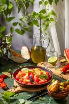 Spicy salad of fresh watermelon balls with basil, lime, rosemary and fennel, topping with olive oil on dark green table surface with sunny light xkwx watermelon vegetable summer food healthy salad basil lime rosemary freshness delicious cheese melon table organic epicure vegetarian plate fruit dinner meal sweet green diet red lunch fresh leaf juicy ripe snack herb closeup rustic overhead nourishment eating dish cookery