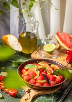 Spicy salad of fresh watermelon balls with basil, lime, rosemary and fennel, topping with olive oil on dark green table surface with sunny light xkwx watermelon vegetable summer food healthy salad basil lime rosemary freshness delicious cheese melon table organic epicure vegetarian plate fruit dinner meal sweet green diet red lunch fresh leaf juicy ripe snack herb closeup rustic overhead nourishment eating dish cookery