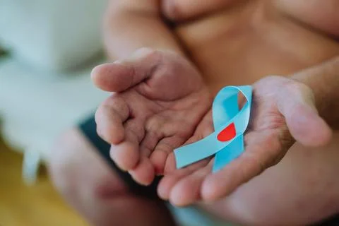 Overweight man holding a blue diabetes support ribbon as a symbol of diabetes awareness. November as Diabetes Awareness Month. 14 November as World Diabetes Day. xkwx diabetes awareness support ribbon symbol overweight man blue ribbon blue circle November Diabetes Awareness Month World Diabetes Day WDD health prevention advocacy education gray ribbon recognition condition managing diabetes public health global observance awareness campaign type 1 diabetes type 2 diabetes gestational diabetes risk factors insulin blood sugar glucose level lifestyle health advocacy disease management early detection health promotion community diabetic community medical condition chronic disease health information sir frederic banting nobel price self-care medical awareness copy space