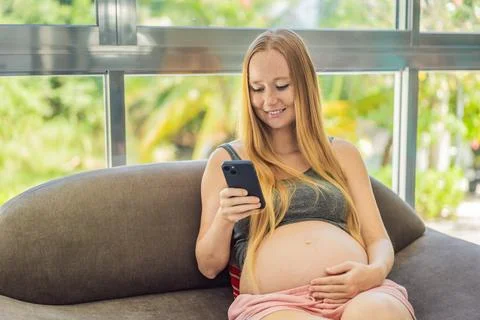 Mobile pregnancy online maternity application. Pregnant mother using phone. Pregnancy, medicine, pharmaceutics, health care and people concept. xkwx pregnant online pregnancy mother application woman app young technology maternity mobile cellphone phone internet beautiful belly expecting expectant home smartphone person abdomen connection motherhood communication anticipation sitting bed african american maternal millennial indoors free space goods tummy smiling prenatal bedroom advertisement childbirth parenthood awaiting computer empty space website parent cheerful