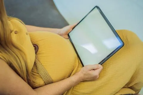 Mobile pregnancy online maternity application. Pregnant mother using phone. Pregnancy, medicine, pharmaceutics, health care and people concept. xkwx pregnant online pregnancy mother application woman app young technology maternity mobile cellphone phone internet beautiful belly expecting expectant home smartphone person abdomen connection motherhood communication anticipation sitting african mobile phone copy space smiling telephone tablet concepts awaiting blank screen millennial lifestyle concept prenatal reading morning photography parent expectance expectation