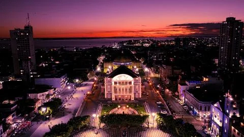 Manaus Brazil. Sunset aerial cityscape of downtown Manaus Amazonas Brazil. Tourism landmark of city. Travel destinations. Night cityscape of downtown district. Manaus Amazonas Brazil. xkwx Sunset City Manaus Amazonas Brazil tourism attraction sidewalk square building medieval colorful nature sunset sky architecture sky postcard symbol famous landmark history historic culture lights twilight bright illuminated illumination evening dusk dark night brazilian skyscraper city town theatre travel sunset skyline outdoors vacations background landscape aerial view downtown urban district cityscape theater village
