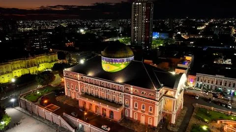 Colorful sunset sky over medieval building at cityscape downtown Manaus Brazil near Amazon river and Amazon Forest. Travel destinations. Sunset skyline. Sunset coastal city at Manaus Brazil. xkwx Colorful Sunset Manaus Amazonas Brazil europe modern architecture sidewalk famous landmark amazon historic skyscraper building museum church medieval theatre square theater dawn dusk evening sunrise sunset sky coast outdoor skyline light bright colorful illumination village city town travel tourism nature outdoors destinations river forest background landscape downtown urban district cityscape