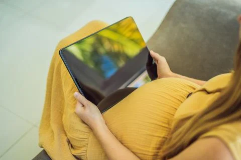 Mobile pregnancy online maternity application. Pregnant mother using phone. Pregnancy, medicine, pharmaceutics, health care and people concept. xkwx pregnant online pregnancy mother application woman app young technology maternity mobile cellphone phone internet beautiful belly expecting expectant home smartphone person abdomen connection motherhood communication anticipation sitting computer website awaiting reading tummy blank holding screen photography african millennial family parenthood telephone programm free space expectance mobile phone childbirth hand