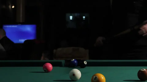 25/35 Man playing billiard. Player is taking a shot and put ball in the hole. Stock Footage 36427143