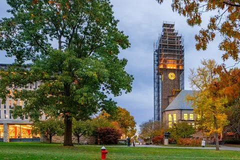 Ithaca, New York, US - October 25, 2023: Night photo of McGraw clock tower with construction scaffolding, landmark at Cornell University, and iconic presence on campus. University found in 1865 xkwx mcgraw tower cornell university college architecture scaffolding campus clock ivy league student clock-tower construction landmark 1865 ithaca ny new york finger lakes upstate study teaching education higher stone iconic design engineering learning structure institution lecture special evening dark school american building fall trees
