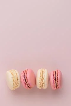 Macaroons on pink background, colorful french cookies pattern. Gift for 8 March, International Women's Day, Valentine Day. Vertical banner with copyspace xkwx macaroon traditional macaron sweet cookie confectionery biscuit french colorful pastry macaroons snack chocolate tasty pastel cream background sugar assortment food dessert cake bakery closeup delicious pink candy color green white top yellow french macaroons falling pastel colored coffee delicate lemon overhead vanilla confection delicious macaroon macarons colourful pattern banner
