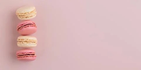 Macaroons on pink background, colorful french cookies pattern. Gift for 8 March, International Women's Day, Valentine Day. Horizontal banner with copyspace xkwx macaroon traditional macaron sweet cookie confectionery biscuit french colorful pastry macaroons snack chocolate tasty pastel cream background sugar assortment food dessert cake bakery closeup delicious pink candy color green white top yellow french macaroons falling pastel colored coffee delicate lemon overhead vanilla confection delicious macaroon macarons colourful pattern banner