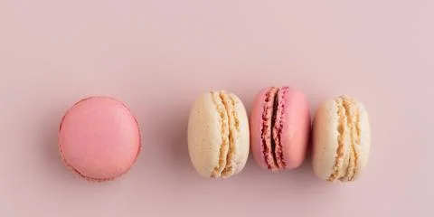 Macaroons on pink background, colorful french cookies pattern. Gift for 8 March, International Women's Day, Valentine Day. Horizontal banner with copyspace xkwx macaroon traditional macaron sweet cookie confectionery biscuit french colorful pastry macaroons snack chocolate tasty pastel cream background sugar assortment food dessert cake bakery closeup delicious pink candy color green white top yellow french macaroons falling pastel colored coffee delicate lemon overhead vanilla confection delicious macaroon macarons colourful pattern banner