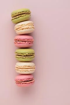 Macaroons on pink background, colorful french cookies pattern. Gift for 8 March, International Women's Day, Valentine Day. Vertical banner with copyspace xkwx macaroon traditional macaron sweet cookie confectionery biscuit french colorful pastry macaroons snack chocolate tasty pastel cream background sugar assortment food dessert cake bakery closeup delicious pink candy color green white top yellow french macaroons falling pastel colored coffee delicate lemon overhead vanilla confection delicious macaroon macarons colourful pattern banner