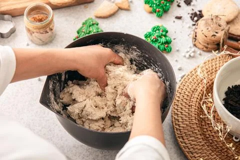 Hands knead thick dough on the kitchen table, decorated with festive decorations for Christmas and New year, baking at home. xkwx christmas food pastry dough homemade flour hand cooking gingerbread baking traditional kitchen table woman holiday xmas cookie sweet sugar bake cook home season cake dessert snack biscuit delicious bowl background celebration domestic person kneading cinnamon rolling lifestyle handmade fresh tasty recipe breakfast natural organic nutrition baked ingredient