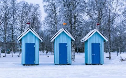 blue cabanas on the beach for changing clothes, winter beach in Oulu xkwx architecture beautiful blue cold country day fence finland forest frost frozen garden home house ice landscape nature oulu outdoor outdoors red row season sky snow snowy tree trees white winter wood wooden north ostrobothnia no people